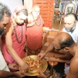 Jagadgurus lighting the first deepam of the Shasta Sahasra Deepa Prabhamark to mark the official commencement of the preparations of the Mahakumbhabhisheka of the Tamil Mahaganapati Balasubrahmanya temple and the Kirata Murti temple