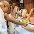 The Matrubhumi publication of the English translation of Prasthana Traya Bhashyas of Bhagavatpada by Panoli V being devotedly offered by Sri Veerendra Kumar to Sri Sannidhanam