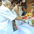 The Matrubhumi publication of the English translation of Prasthana Traya Bhashyas of Bhagavatpada by Panoli V being devotedly offered by Sri Veerendra Kumar to Sri Sannidhanam